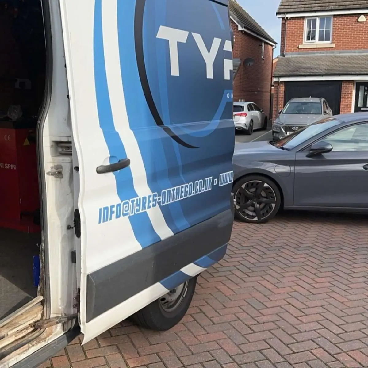 Technician repairing a tyre puncture on-site in West Yorkshire